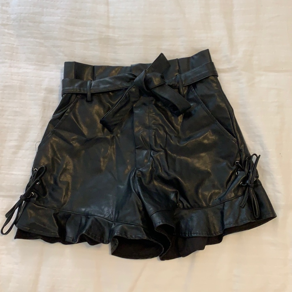 Pleather shorts with tie and ruffles on bottom